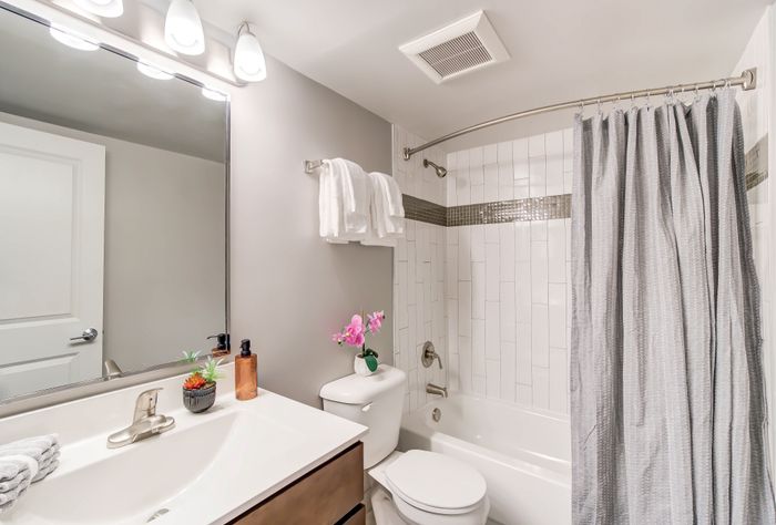 Newly Renovated Bathrooms With Tile Tub Surrounds | Creekside Village | Affordable Alexandria VA Apartments