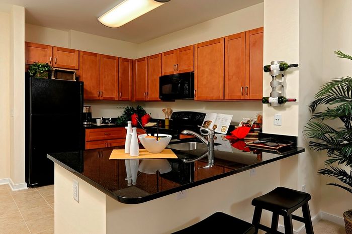 Modern Kitchen With Granite Countertops, Breakfast Bar & Abundant Cabinet Space | Madison at Ballston Station | Arlington VA Apartments