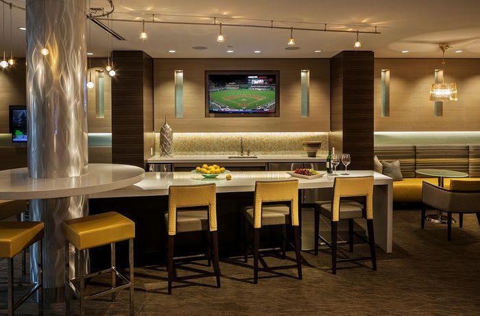 Contemporary Club Room With Bar Area, TV & Numerous Seating Areas | Madison at Ballston Station | Arlington VA Apartments