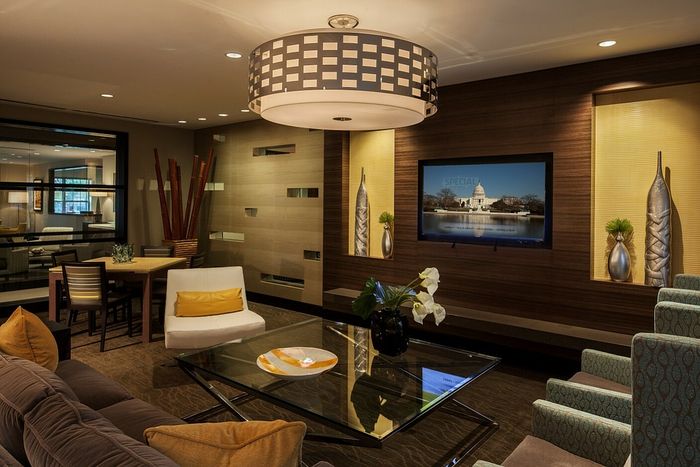Contemporary Club Room With Bar Area, TV & Numerous Seating Areas | Madison at Ballston Station | Arlington VA Apartments