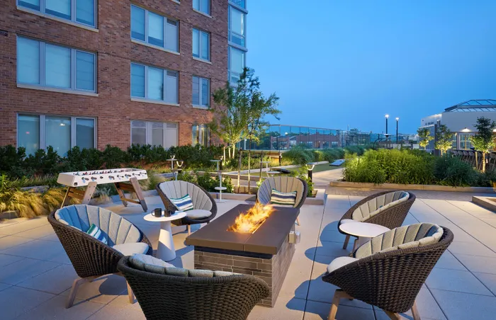 Fire Pit & Foosball at Night | Meridian 2250 at Eisenhower Station | Luxury Alexandria VA Apartments