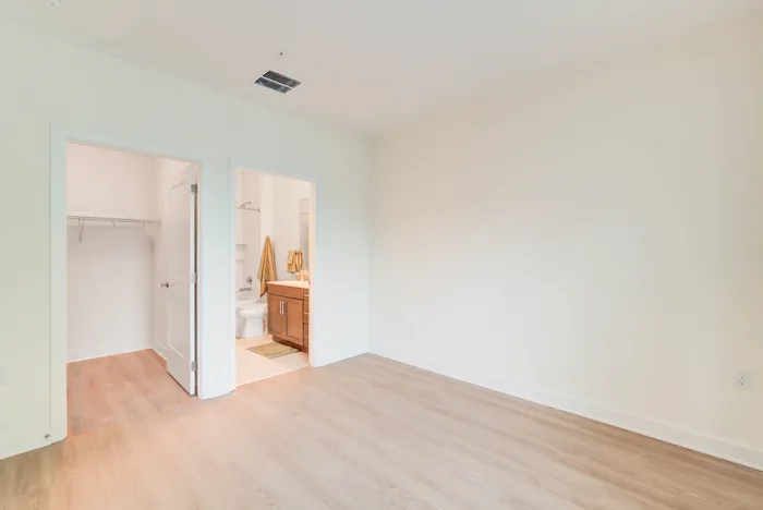 Large Primary Bedroom With Walk-In Closet & Ensuite Bathroom| Indigo at McLean Station | Affordable Tysons Corner Apartments | Affordable Fairfax VA Apartments | Affordable McLean Apartments