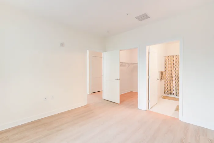Large Primary Bedroom With Walk-In Closet & Ensuite Bathroom Indigo at McLean Station | Affordable Tysons Corner Apartments | Affordable Fairfax VA Apartments | Affordable McLean Apartments