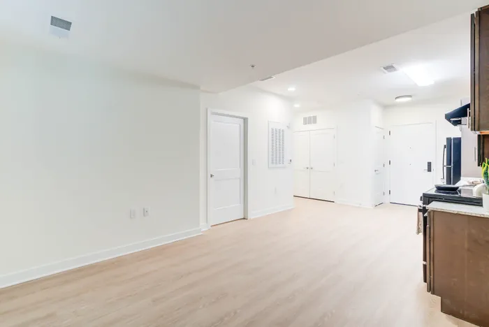 Living/Dining Area- A 1BR-H ANSI Accessible Floor Plan | Indigo at McLean Station | Affordable Tysons Corner Apartments | Affordable Fairfax VA Apartments | Affordable McLean VA Apartments