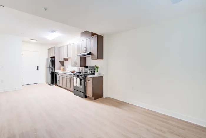 Living/Dining/Kitchen Area- A 1BR-H ANSI Accessible Floor Plan | Indigo at McLean Station | Affordable Tysons Corner Apartments | Affordable Fairfax VA Apartments | Affordable McLean VA Apartments