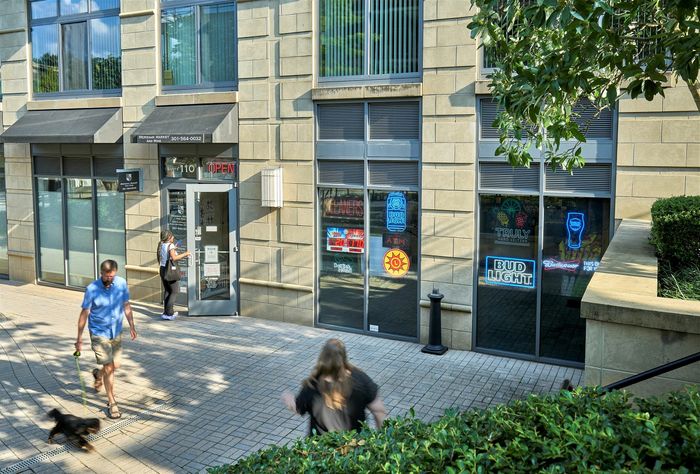 Ultimate convenience at your doorstep: Meridian Market at Meridian at Grosvenor Station offers a curated selection of fine wines, cold beer, and grocery staples, plus onsite dry cleaning services for seamless North Bethesda living | North Bethesda MD Luxury Apartments | Rockville MD Apartments