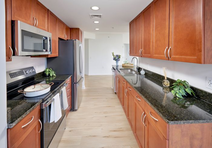 Renovated Copland Two Bedroom eat-in kitchen with stainless steel appliances, granite countertops, and updated fixtures | Meridian at Grosvenor Station | Luxury North Bethesda MD Apartments | Luxury Rockville MD Apartments