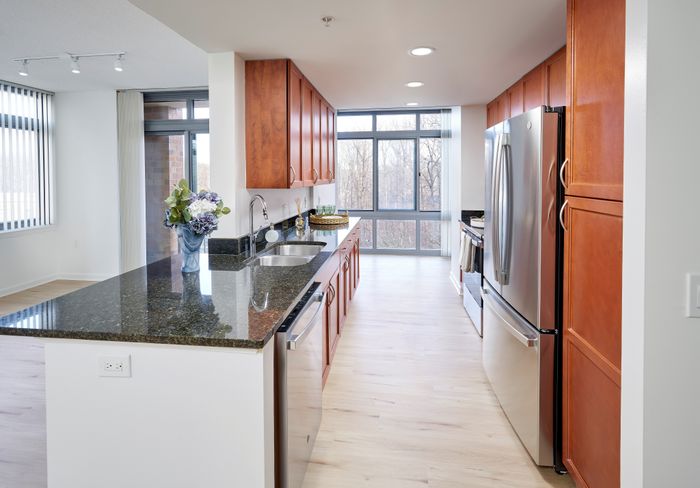 Renovated Copland Two Bedroom eat-in kitchen with stainless steel appliances, granite countertops, and updated fixtures | Meridian at Grosvenor Station | Luxury North Bethesda MD Apartments | Luxury Rockville MD Apartments