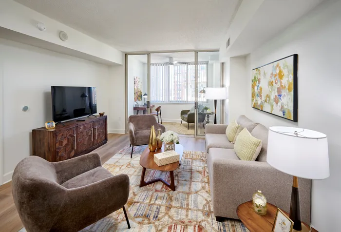 Renovated one bedroom apartment with sunroom at Meridian at Eisenhower Station with granite countertops, stainless steel appliances, wood-style flooring, and updated lighting and other features | Alexandria VA Apartments | Luxury Alexandria VA Apartments