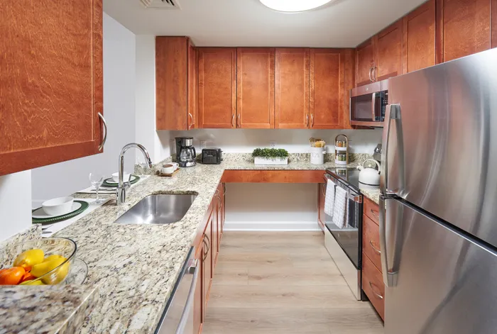 Newly renovated Belmont 1BR kitchen with chef-inspired stainless steel appliances and custom cabinetry. | Meridian at Eisenhower Station | Luxury Alexandria VA Apartments