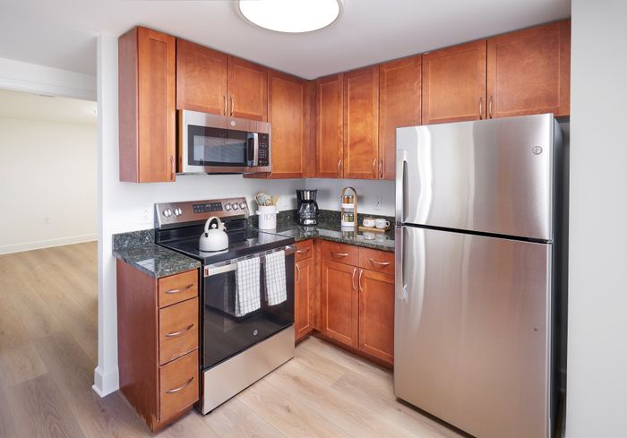 Renovated Sterling 1BR with den kitchen at Meridian at Eisenhower with modern lighting and fixtures. | Meridian at Eisenhower Station | Luxury Alexandria VA Apartments