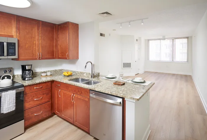 Open-concept kitchen and living area in renovated Ashton 2BR at Meridian at Eisenhower Alexandria. | Luxury Alexandria VA Apartments