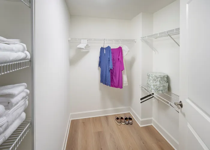 Walk-in closet in renovated Newport 1BR at Meridian at Eisenhower with ample storage and wood-style flooring. | Luxury Alexandria VA Apartments