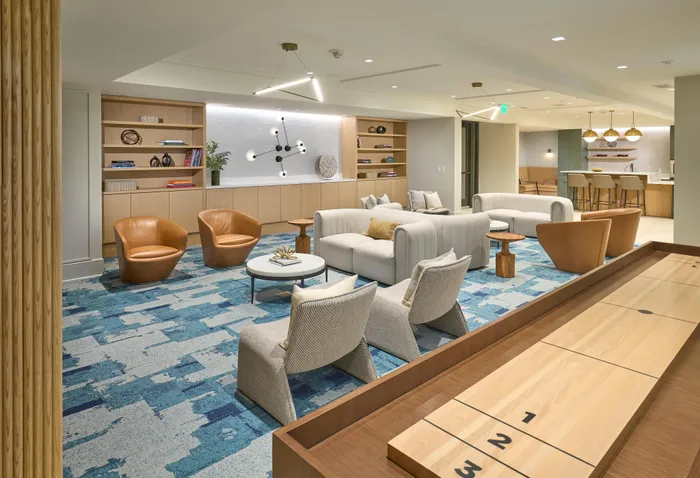 Indigo at McLean Station Phase I Club Room With Shuffleboard, TV, Kitchen & More | Affordable Tysons Corner Apartments | Affordable McLean VA Apartments | Affordable Fairfax VA Apartments