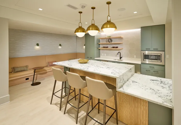 Indigo at McLean Station Phase I Club Room With Shuffleboard, TV, Kitchen & More | Affordable Tysons Corner Apartments | Affordable McLean VA Apartments | Affordable Fairfax VA Apartments