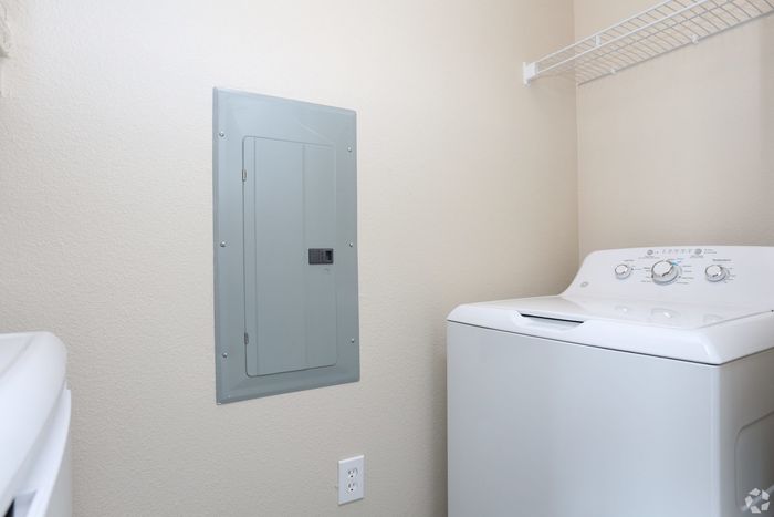 Stylish laundry room with energy-efficient washer and sleek control panel