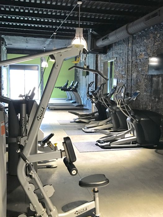 Modern fitness center with state-of-the-art cardio machines and strength equipment, ideal for a healthy lifestyle.