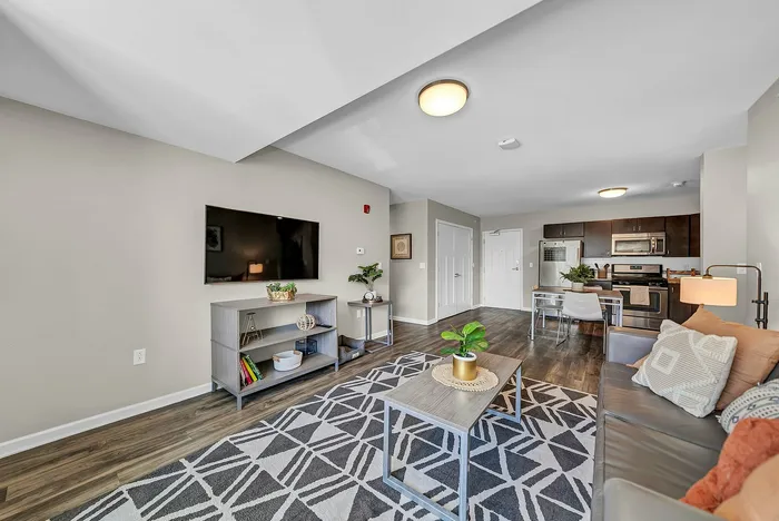 Bright and modern living room and open floor plan concept, fully furnished.
