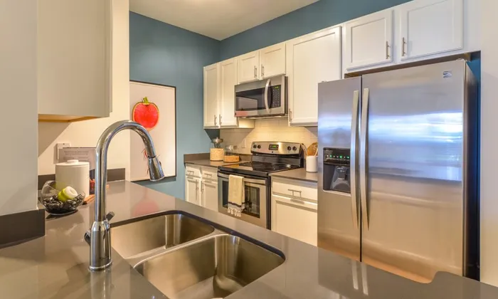 Modern Kitchen with Stainless Steel Appliances at The Kendrick located in Atlanta, GA  30324