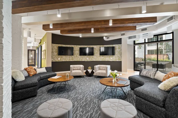 Expansive clubhouse with coffee bar and tv's at The Parq at Chesterfield Apartment Homes, Chesterfield, MO  63017
