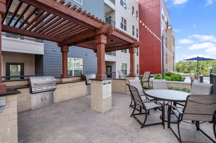Dog-Friendly Apartments In Chesterfield, MO - The Parq At Chesterfield - BBQ Grill With Picnic Table Covered By Gazebo And Scenic View