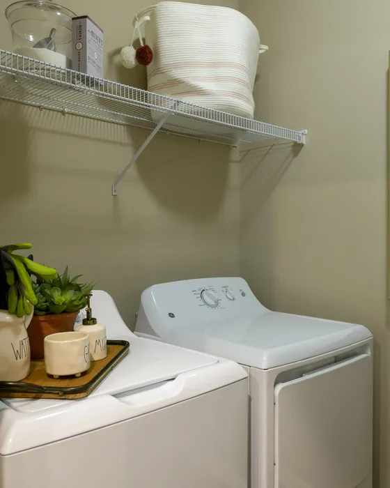 West Athens GA Apartments - Lullwater at Jennings Mill - Laundry Area with White, Full-Sized, Washer and Dryer, Overhead Shelving