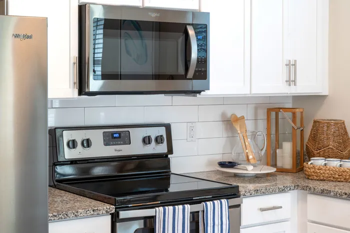 upclose of stove and microwave in kitchen