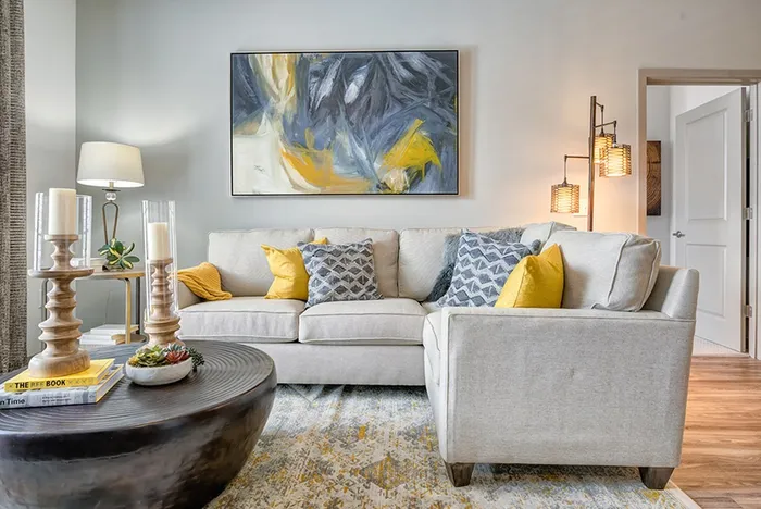 Gray sectional with yellow and blue accent peiecs