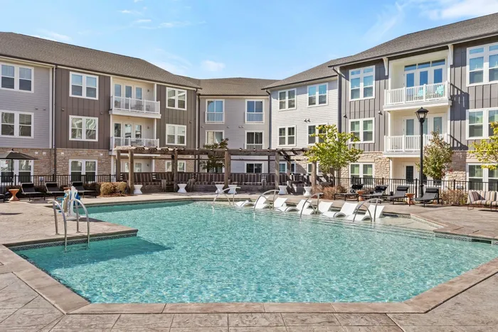 Studio Apartments in Matthews, NC - Chestnut Farm - Resort-Style Swimming Pool with Lounge Chairs, Cabanas, Umbrellas, and Cozy Seating
