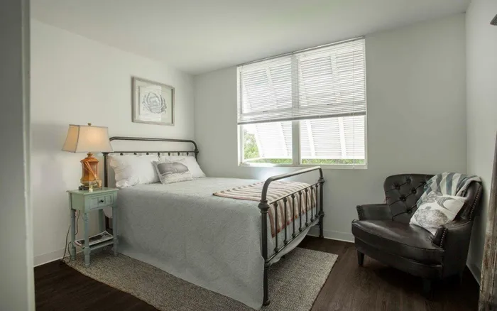 Bedroom w/ chair and bed