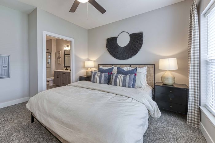 two bedroom model primary bedroom Encore Apartments Belton MO