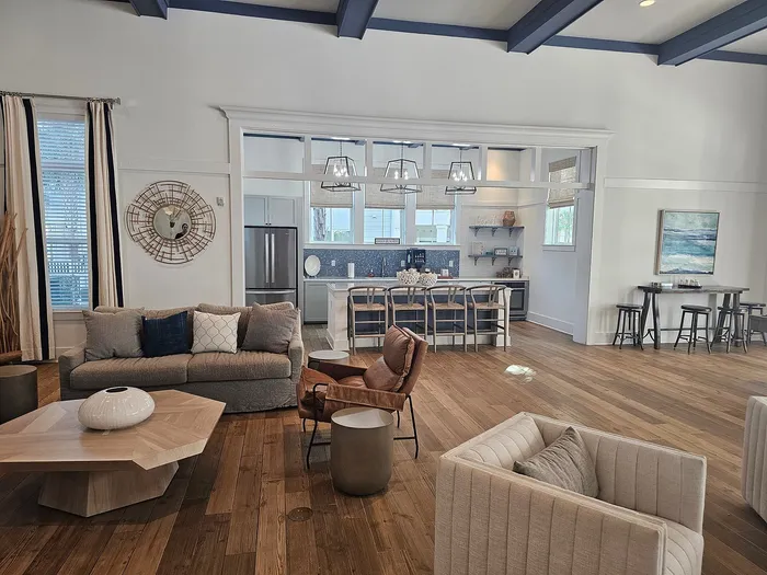 Inviting open-concept living area with modern kitchen, stylish seating, and elegant decor.