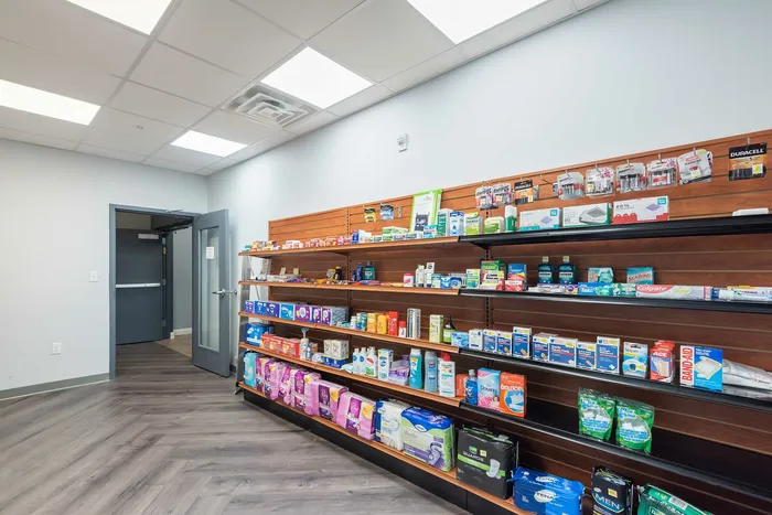 Bright and welcoming room featuring a well-stocked shelf with assorted health and personal care products, perfect for everyday needs.