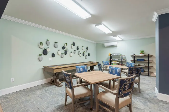Chic and inviting recreational room featuring modern decor and stylish seating, perfect for social gatherings.