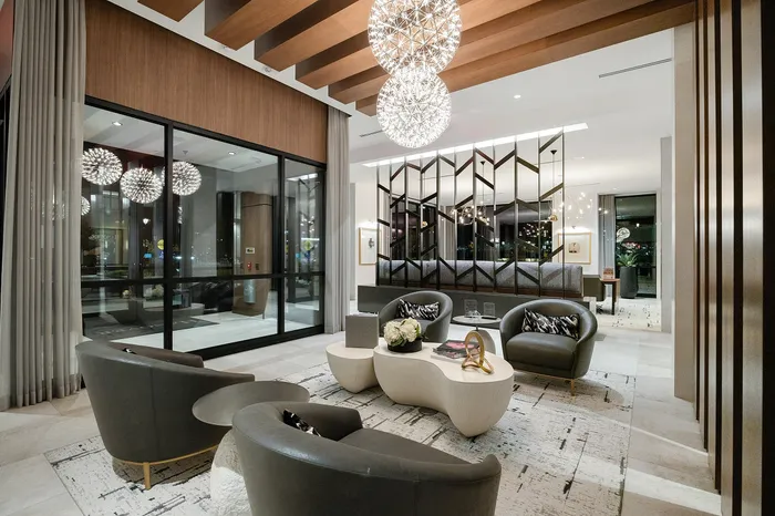 Luxurious modern lounge with elegant seating, chic lighting fixtures, and contemporary decor, perfect for sophisticated gatherings.