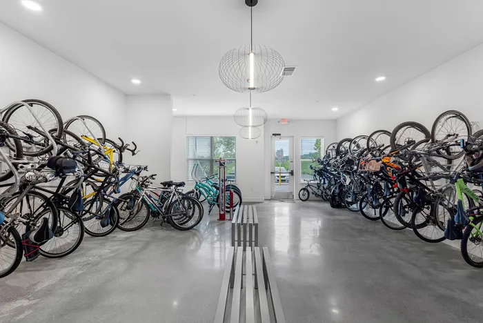 Modern and well-organized bike storage room with sleek design and ample space for bicycles.