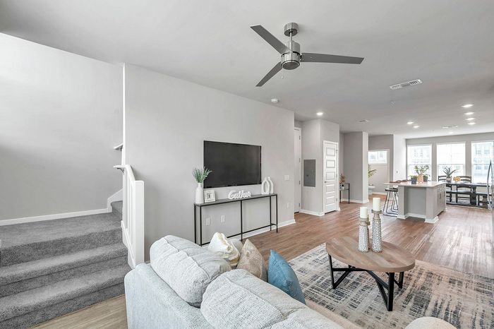 Modern open-concept living space featuring sleek design, stylish furniture, and abundant natural light.