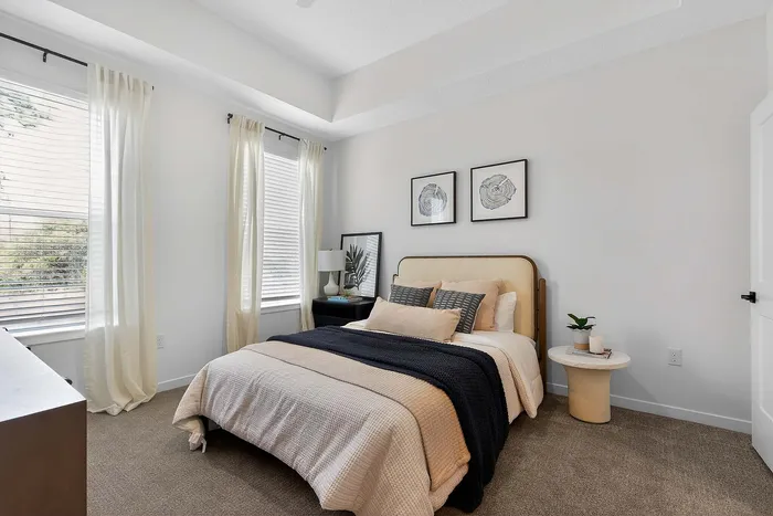Elegant bedroom with stylish decor, featuring a cozy bed, soft lighting, and modern wall art.