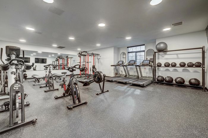 Sandy, UT Apartments With In-Unit Washer And Dryer - Dry Creek -  Fitness Center Equipped With Cardio And Strength Training Machines, Workout Benches, Weighted Medicine Balls, TVs, Weights, And Large Mirrors