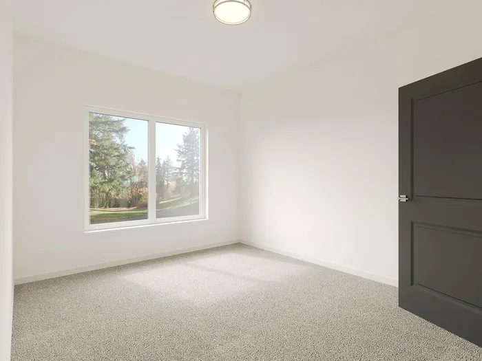 Bright and inviting empty room with large window offering scenic outdoor views, perfect for personalization.