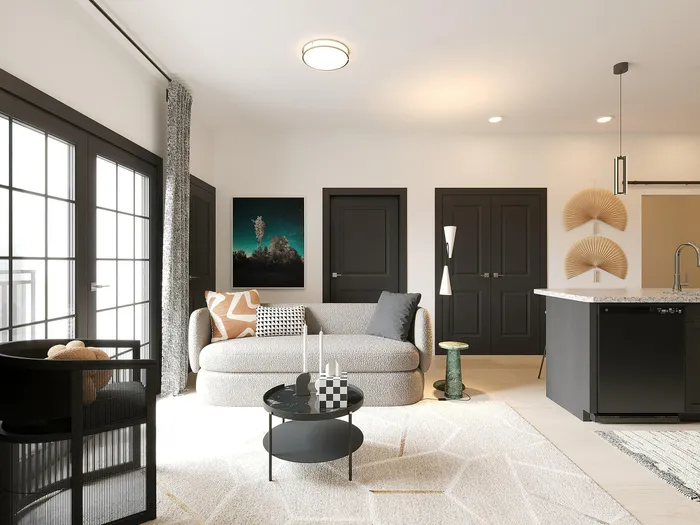Modern living room with cozy sofa, elegant decor, and sleek open-plan kitchen featuring a chic island countertop.