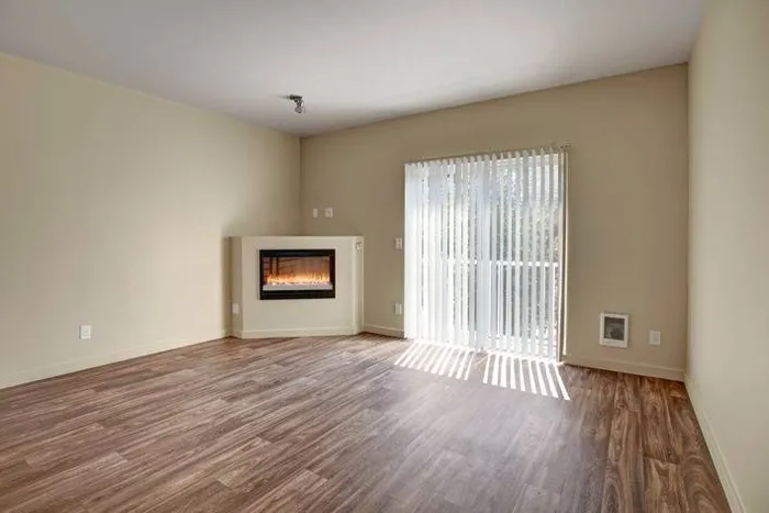 Living Room with Electric Fire Place (21-07504) | Puyallup WA Apartments | Brookstone at Edgewater Apartments