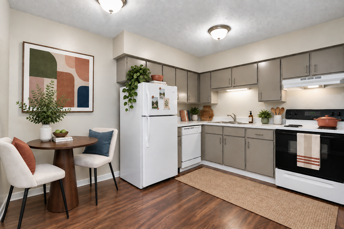 Charming kitchen with modern appliances, cozy dining nook, and elegant decor for a stylish living experience.
