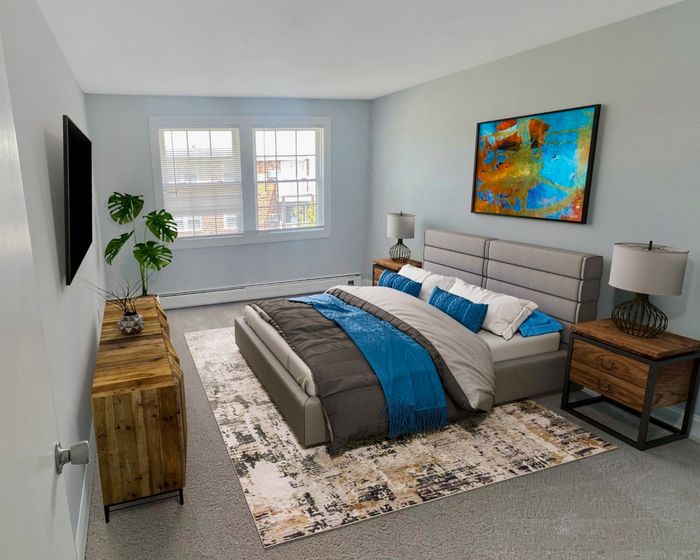 Bedroom with carpeted flooring in a Dover, NH apartment