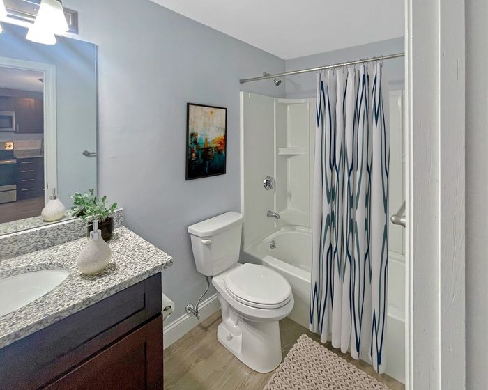 Updated bathroom with modern vanity at Winchester Arms