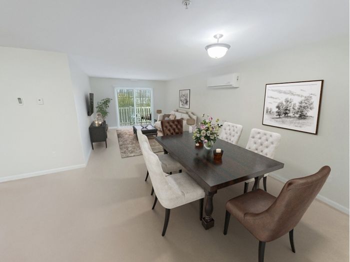 Inviting apartment dining area with open living space at Allard’s Grove in Dracut, MA