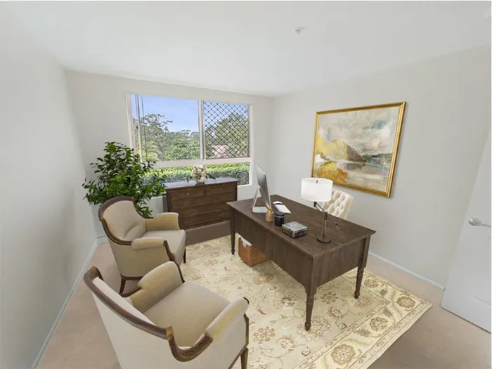 Well-lit and comfortable apartment home office space with window at Allard’s Grove in Dracut, MA