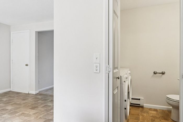 View from the Meadowbrook Village kitchen toward the adjoining laundry and half bathroom.