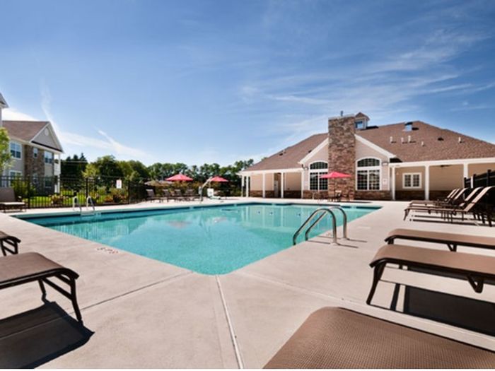 Garden Style Apartments for Rent in Mt. Laurel Township NJ - Laurel Green - Saltwater Pool with Lounge Chairs and Red Umbrellas