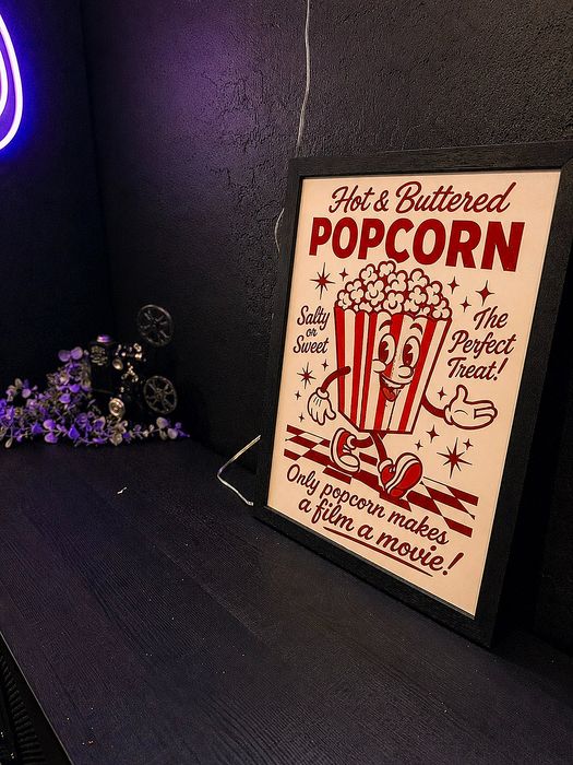 Charming vintage poster with a playful popcorn design, perfect for a cozy home theater ambiance.